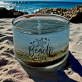 Beach themed candle with sand and seashell embeds